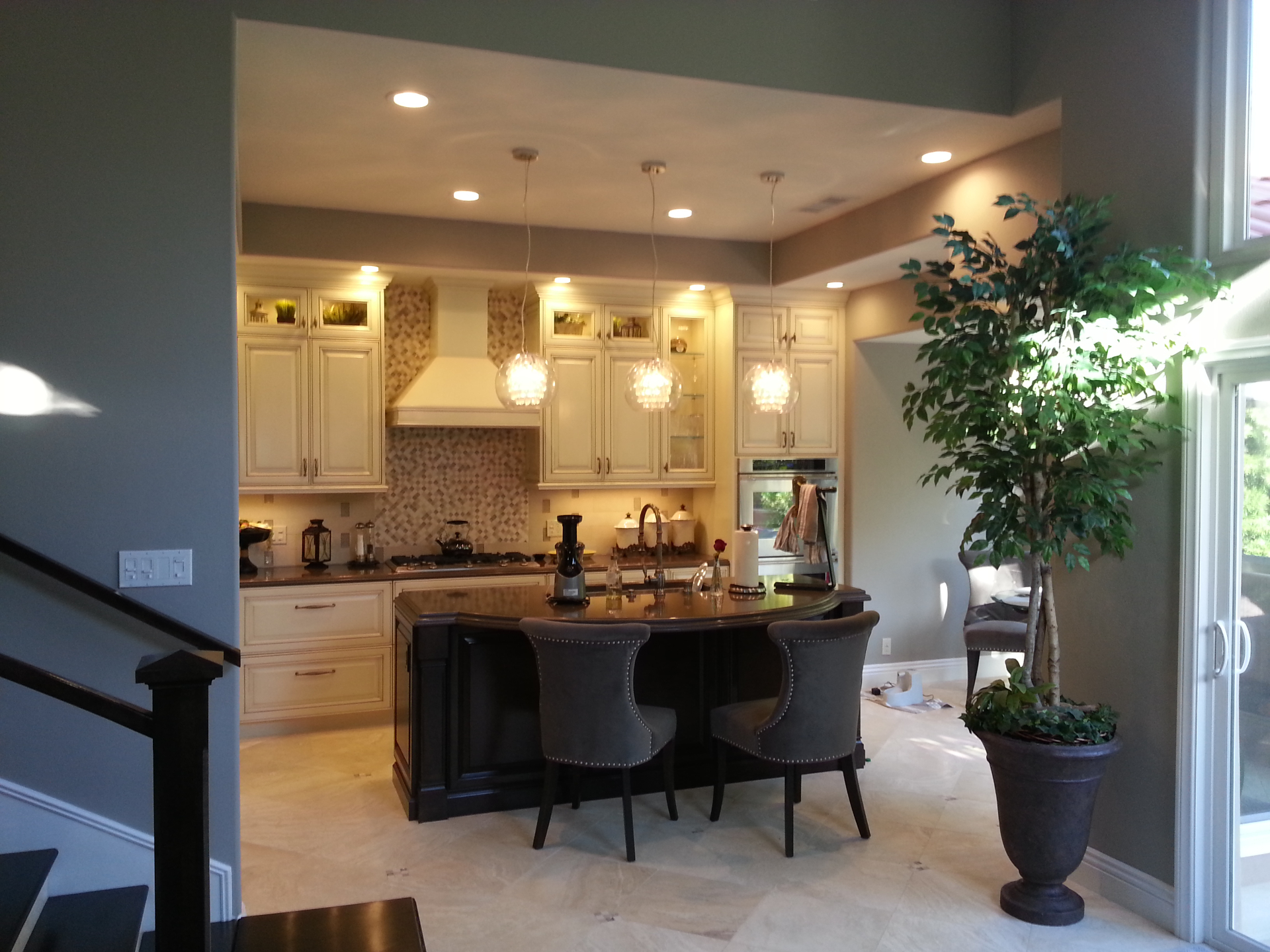 Huntington Beach kitchen remodel with recessed lighting, pendant lights over island, and under-cabinet accent lighting